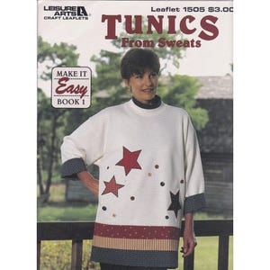 May include: A woman modelling a white tunic with red star appliqués and decorative buttons. The tunic features black and white patterned cuffs and a red and tan striped hem. The image includes the text "TUNICS From Sweats".