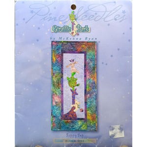 May include: A fabric panel from the "Giraffe Park" collection by McKenna Ryan. The panel features a giraffe with stacked animals, including a turtle and a bunny. The panel is labeled "Tippy Top" and measures 15" x 28 1/2".