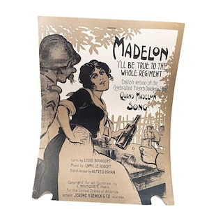 May include: A vintage sheet music cover for the song "Madelion: I'll Be True to the Whole Regiment." The cover features a black and white illustration of a soldier and a woman, with the song title and lyrics printed in black text on a tan background.