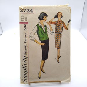 May include: Vintage Simplicity printed sewing pattern 2734. The pattern features illustrations of two women wearing outfits. One woman is wearing a green vest, white shirt, and black skirt. The other is wearing a plaid top and skirt. The pattern is marked "Miss Size 15 Bust 35".