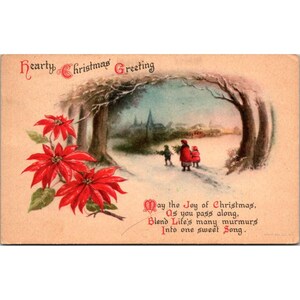 Postal vintage de Navidad de la década de 1910 con flores de Pascua y escena nevada, dirigida y sellada. Sin enviar.