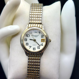 Orologio vintage da donna al quarzo Gruen Precision con cinturino elastico, fondello in acciaio inossidabile, movimento giapponese, dettagli in oro e argento