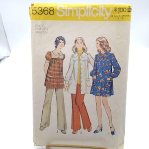 May include: Vintage Simplicity sewing pattern, size 10 maternity, showcasing three 1970s outfits. The yellow and white pattern envelope displays illustrations of the outfits in red plaid, white, and blue floral prints. Bust size is 32.5 inches.