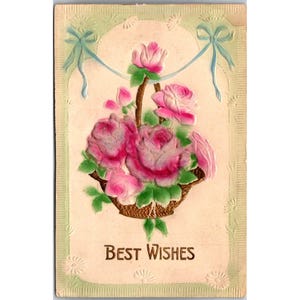 Postal antigua en relieve con cesta de rosas rosadas "Mis mejores deseos", hecha en Alemania. Vintage.