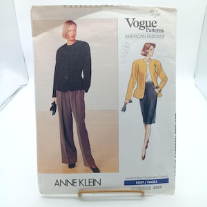 May include: A vintage Vogue sewing pattern for a jacket and pants by Anne Klein. The pattern is for size 16 1/2 and is labeled "Easy/Facile".