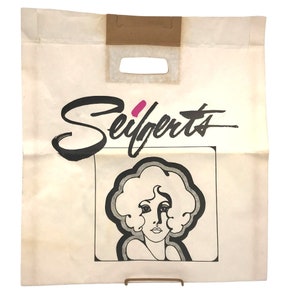 Bolsa de compras vintage de la tienda Seifert, arte de cabeza de aleta en blanco y negro, bolsa de ropa de papel grande con asas reforzadas de cartón