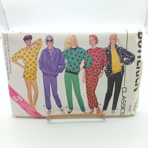 May include: A sewing pattern for five different tops and pants. The pattern includes a guide to overlock sewing. The pattern is for sizes L-XL.