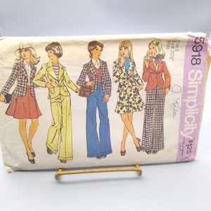 May include: Simplicity sewing pattern number 5918 for a jacket and trousers. The pattern is for sizes 8-14, bust 31 1/2 inches. The pattern is for misses. The pattern is shown on four models wearing different versions of the pattern. The models are wearing a plaid jacket and skirt, a yellow jacket and trousers, a blue jacket and trousers, and a floral jacket and skirt.