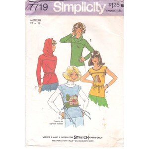 May include: Simplicity pattern 7719, with illustrations of tops. The pattern includes a hooded jacket, a cowl-neck sweater, and two other tops with various design elements. The pattern is for a medium size, 12-14.