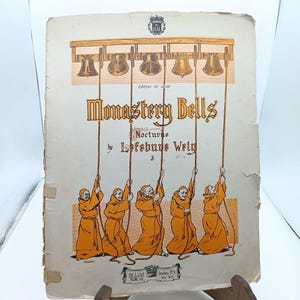 May include: A vintage sheet music cover for a piece called "Monastery Bells" by Lefebure Wely. The cover features an illustration of monks ringing bells from a tower.