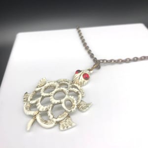 White Enamel Turtle Pendant Necklace, Retro Openwork with Red Poured Glass Eyes on Vintage Gold Tone Chain