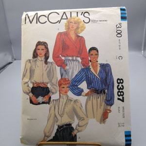 May include: A vintage McCall's sewing pattern for blouses, featuring four different styles. The pattern number is 8387, and the size is 12, bust 34. The pattern is for blouses only.