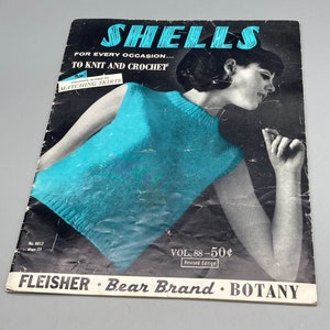 May include: A vintage knitting and crochet pattern book featuring a woman wearing a turquoise sleeveless top. The book cover has the title "SHELLS" and the text "FOR EVERY OCCASION... TO KNIT AND CROCHET". The book is volume 88 and costs 50 pence.
