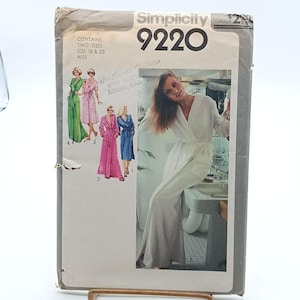 May include: Simplicity sewing pattern number 9220 for a robe. The pattern includes two sizes, 18 and 20, for misses. The pattern shows a white robe with a long, flowing design. The pattern also includes a smaller image of a woman wearing a pink robe.