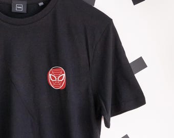May include: Black t-shirt with a red and white Spider-Man mask embroidered on the chest. The tee has short sleeves and a crew neck. The brand name "TERQ" is visible on the upper left.