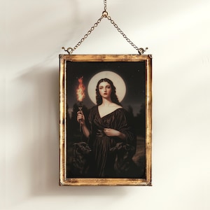 May include: A framed painting of a woman in a black dress holding a torch. She is standing in front of a full moon and two black dogs. The frame is gold.