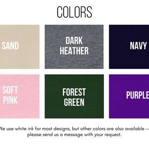 May include: A color chart showing different t-shirt colors available for purchase. The colors are: Sand, Dark Heather, Navy, Soft Pink, Forest Green, and Purple.