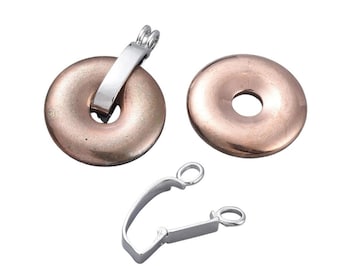 May include: Two round, copper-coloured metal clasps with a silver-toned metal bar and a silver-toned metal hook clasp.