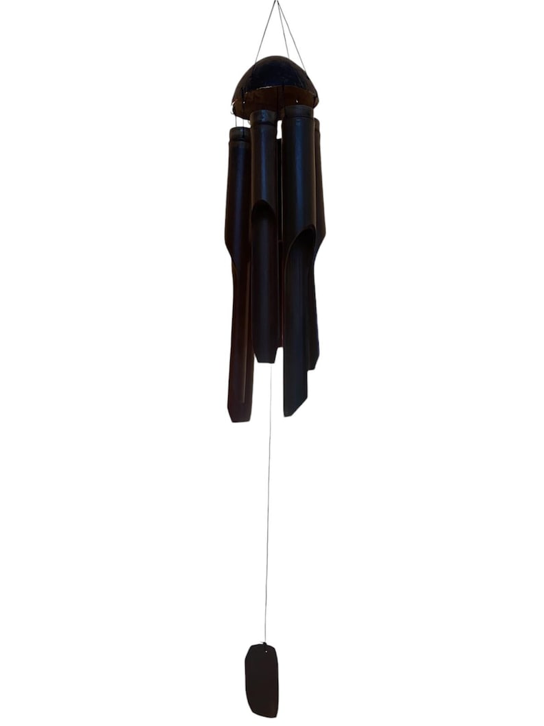 May include: A black bamboo wind chime with a round top and five hanging tubes. The tubes are hollow and have a natural wood finish.