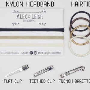May include: A set of hair accessories including nylon headbands in black, beige, and white, hair ties in black, brown, beige, and white, a flat clip, a teethed clip, and a French barrette.  The text "ALEX & LEIGH HANDMADE" is printed on a white card.