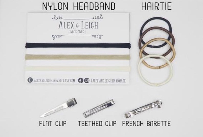 May include: A set of hair accessories including nylon headbands in black, beige, and white, hair ties in black, brown, beige, and white, a flat clip, a teethed clip, and a French barrette.  The text "ALEX & LEIGH HANDMADE" is printed on a white card.