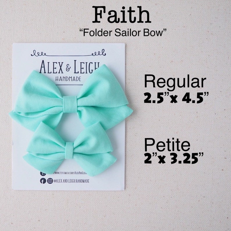 May include: Two aqua blue fabric hair bows, one larger and one smaller, with the text "Faith" "Folder Sailor Bow" "ALEX & LEIGH HANDMADE" and the sizes "Regular 2.5"x 4.5" Petite 2"x 3.25"