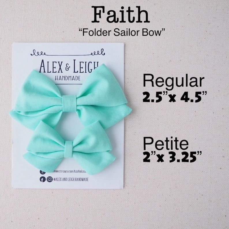 May include: Two aqua blue fabric hair bows, one larger and one smaller, with the text "Faith" "Folder Sailor Bow" "ALEX & LEIGH HANDMADE" and the sizes "Regular 2.5"x 4.5" Petite 2"x 3.25"