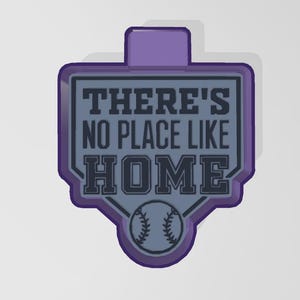 May include: Purple baseball home plate cookie cutter with a baseball graphic and the text "There's no place like home".