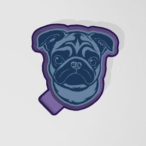 May include: A blue pug face design with a purple outline and a small purple rectangle at the bottom. The pug's face is detailed with dark blue shading, creating a 3D effect. The design is set against a white background.