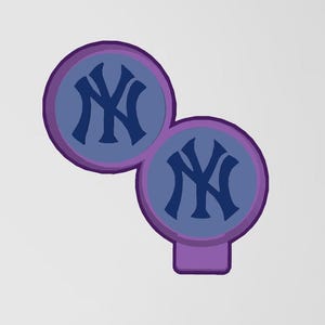 May include: Two overlapping circular patches featuring the dark blue New York Yankees NY logo centered on a light blue background. Each circle is outlined with a thick purple border, and a small purple rectangular tab extends from the bottom circle.