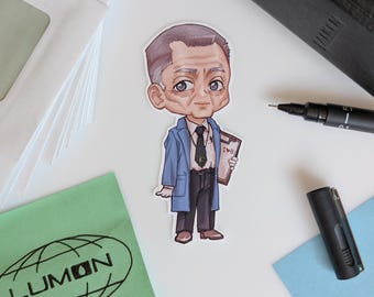 May include: A sticker of a cartoon illustration of an older man in a blue coat and black tie, holding a clipboard. The sticker is on a white surface with a black pen, a black pen cap, and a green cloth with the word "LUMON" printed on it.