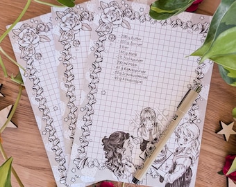 May include: Recipe cards with a grid pattern and floral border. The cards feature a list of ingredients in German, illustrations of anime-style characters, and a Micron pen.