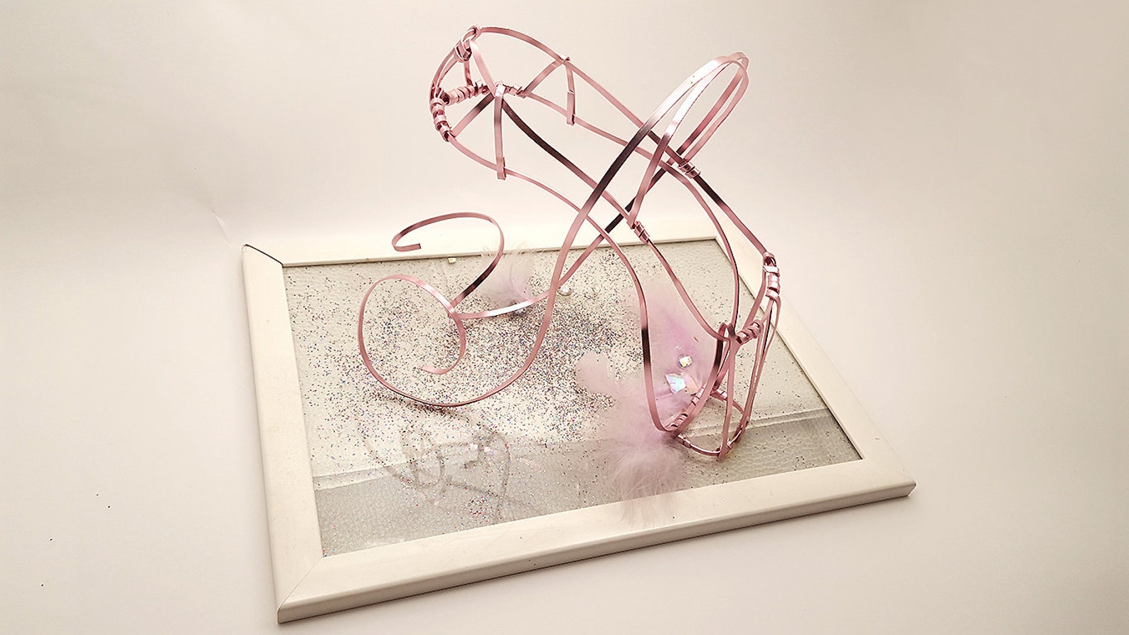 pink ballet shoe in aluminum wire