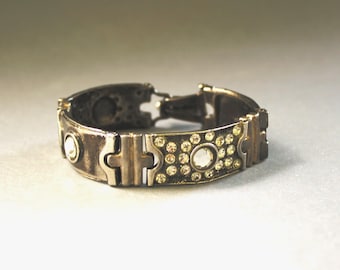 Armband von Luigi Briglia Silberfarben mit klaren geschliffenen Steinen besetzt mit Signatur