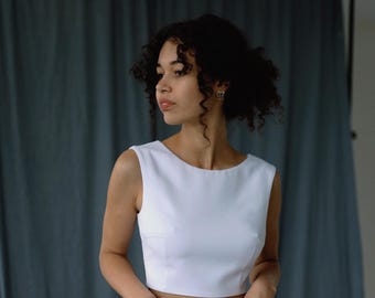 White simple wedding corset top with high neck and open back, sleeveless