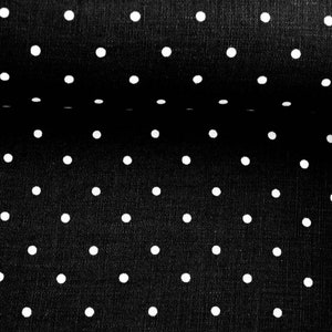 May include: Black fabric with a white polka dot pattern. The fabric is folded in half, showing the pattern on both sides.