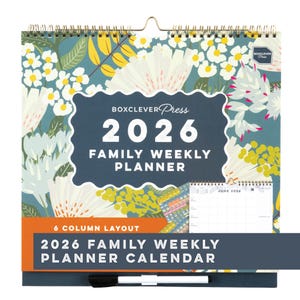 May include: A 2026 Family Weekly Planner Calendar with a floral design. The calendar features a 6-column layout and includes the text "BOXCLEVER Press" and "2026 Family Weekly Planner Calendar". The calendar is spiral-bound with a hanging loop.