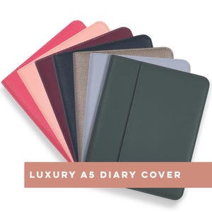 May include: A set of eight A5 diary covers in a variety of colours, including pink, burgundy, navy, beige, light blue, and dark green. The covers are made from textured faux leather and feature a flap closure. The text "LUXURY A5 DIARY COVER" is displayed at the bottom of the image.