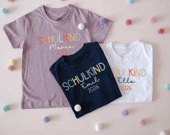 Tshirt zur Einschulung mit Aufdruck Schulkind 2026 mit Name für Kindergartenabschied oder als Outfit zur Einschulung mit Personalisierung