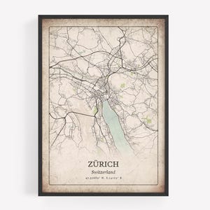 May include: Framed map print of Zürich, Switzerland, in a vintage style. The map features a detailed network of streets and waterways, with the city name and coordinates at the bottom. The frame is black.