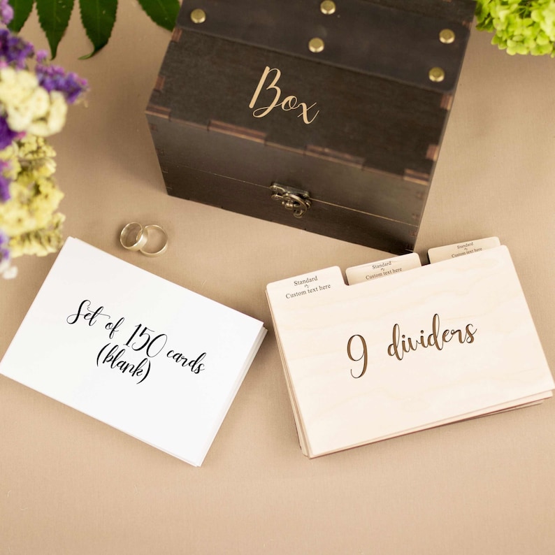 May include: A wooden box with a lid, labeled "Box", containing a set of 150 blank cards and 9 dividers. The cards are white and the dividers are made of wood.