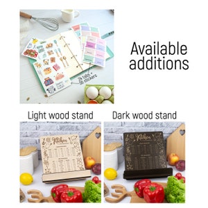 May include: A wooden kitchen conversion chart with a light wood stand and a dark wood stand. The chart includes cooking measurements and conversions. The chart is surrounded by kitchen-themed illustrations.