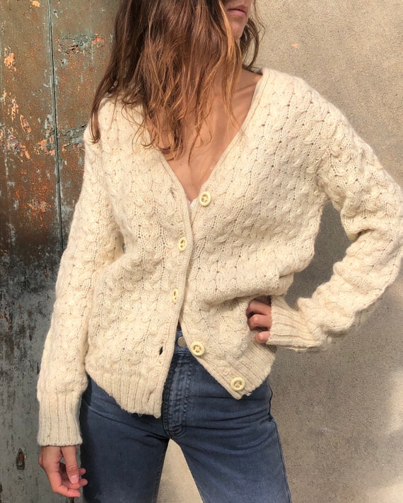 Soft white cable-knit wool cardigan made in Italy