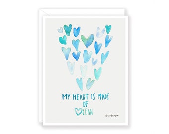 May include: A watercolor illustration of a heart made of blue and green hearts. The text "My heart is made of ocean" is written below the heart.
