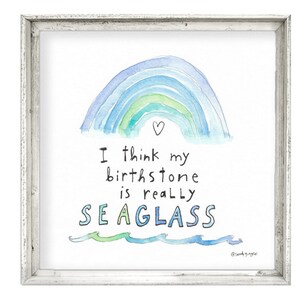 May include: A watercolor painting of a rainbow with a heart at the top. The text below reads "I think my birthstone is really SEAGLASS" with a wavy line underneath.