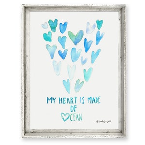 May include: A watercolor painting of a heart made of blue and green hearts. The text "My heart is made of OCEAN" is written below the heart.