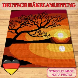 May include: A crocheted landscape depicting a sunset scene with a tree silhouette. The artwork features a gradient of colors, including red, orange, and yellow. The text "DEUTSCH HÄKELANLEITUNG" is at the top. The image also includes a German flag heart and the text "SYMBOLIC IMAGE, NOT A PHOTO!"