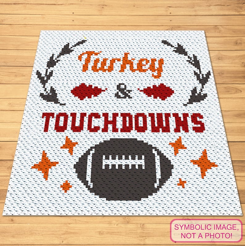 May include: A white crochet blanket with the text "Turkey & Touchdowns" in red and orange. A black and white football is in the center of the blanket with orange stars around it.