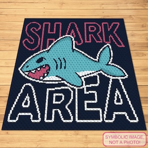 May include: A blue and white pixelated image of a shark with an open mouth and the text "SHARK AREA" in red and white letters on a dark blue background.