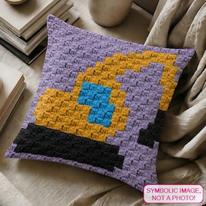 May include: A square crochet pillow with a pixelated design. The pillow features a purple background with a yellow, blue, and black graphic. The text "SYMBOLIC IMAGE, NOT A PHOTO!" is in the lower right corner.